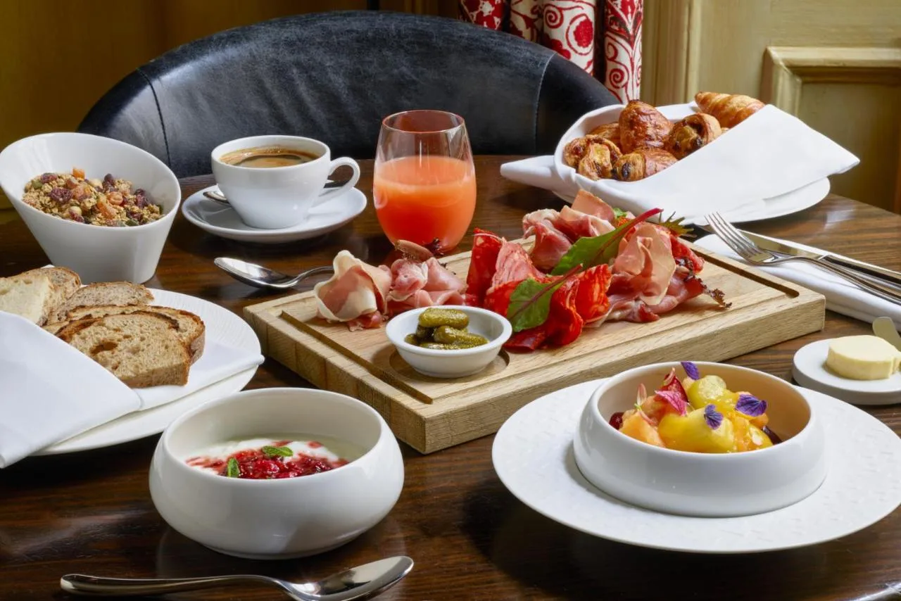 Breakfast table with food and drinks at The Gore London on Queen's Gate