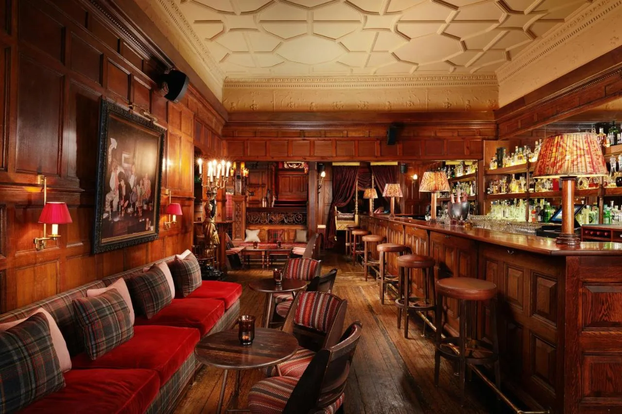 Bar 190 with red couches at The Gore London, South Kensington