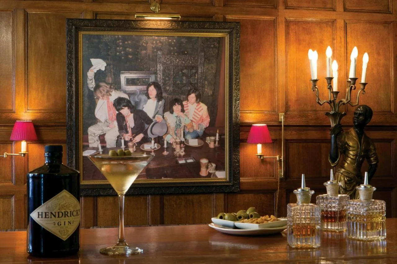 Table with wine glass and artwork at The Gore London